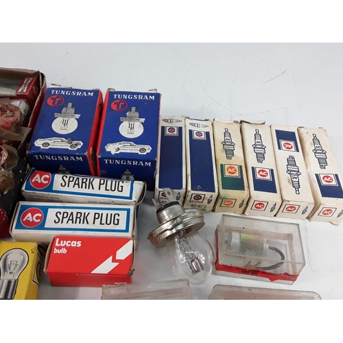 565 - Box of vintage spark plugs and bulbs