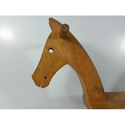 576 - Wooden rocking horse, 50cms in height and 75cms in length