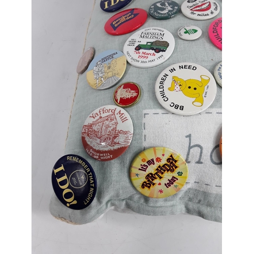 590 - Cushion of badges