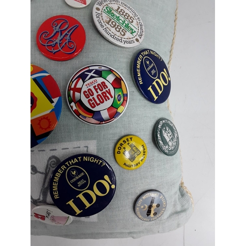 590 - Cushion of badges