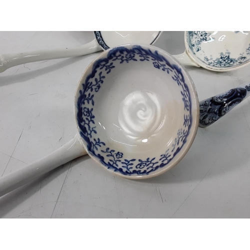 609 - Box of blue and white sauce ladles