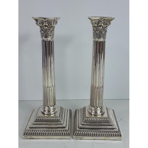 646 - Pair of tall silver column candlesticks