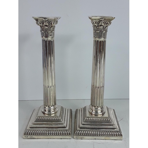 646 - Pair of tall silver column candlesticks