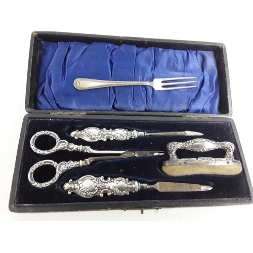 668 - Cased silver 4 piece manicure set and a fork