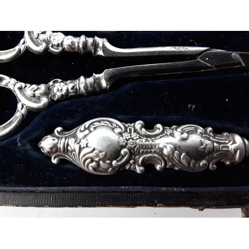 668 - Cased silver 4 piece manicure set and a fork