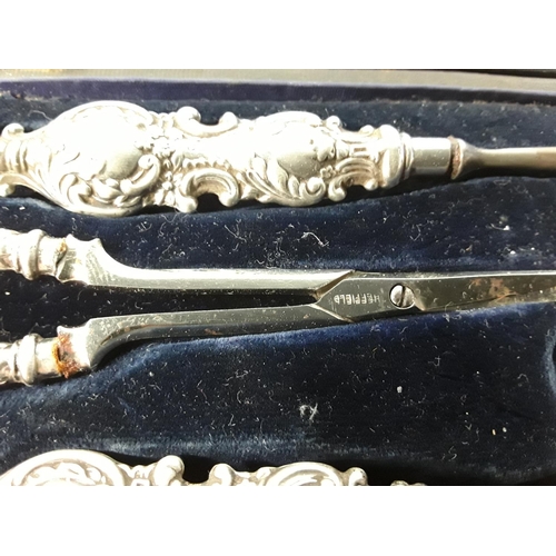 668 - Cased silver 4 piece manicure set and a fork