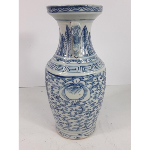 722 - Vintage oriental blue and white vase, 24cms in height