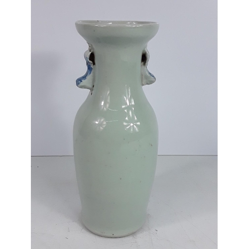 723 - Vintage oriental blue and white vase, 23cms in height