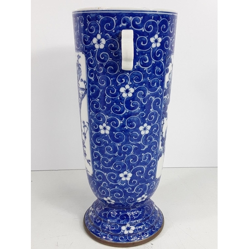 724 - Vintage oriental blue and white vase, 25cms in height