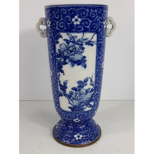 724 - Vintage oriental blue and white vase, 25cms in height