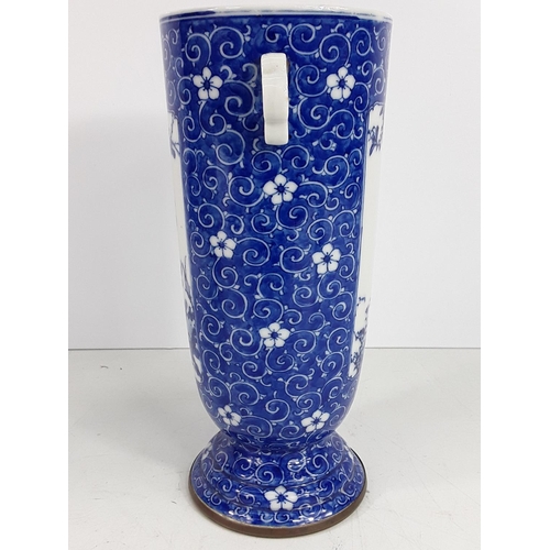 724 - Vintage oriental blue and white vase, 25cms in height