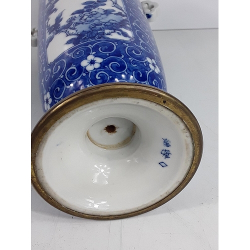 724 - Vintage oriental blue and white vase, 25cms in height