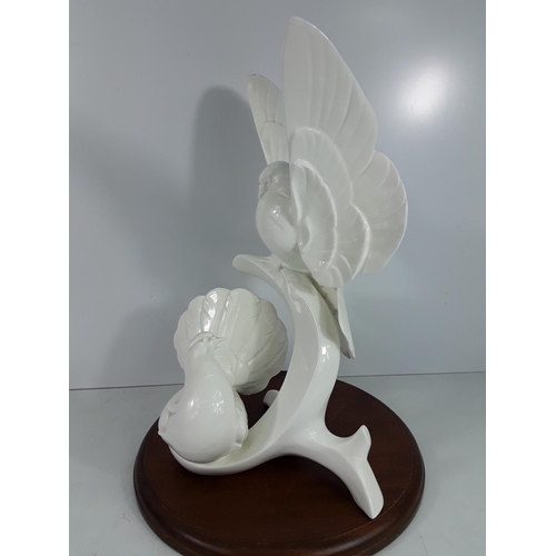 740 - Large Doulton Images of nature Doves on wooden base, 40cms in height without the plinth