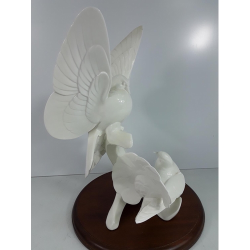 740 - Large Doulton Images of nature Doves on wooden base, 40cms in height without the plinth