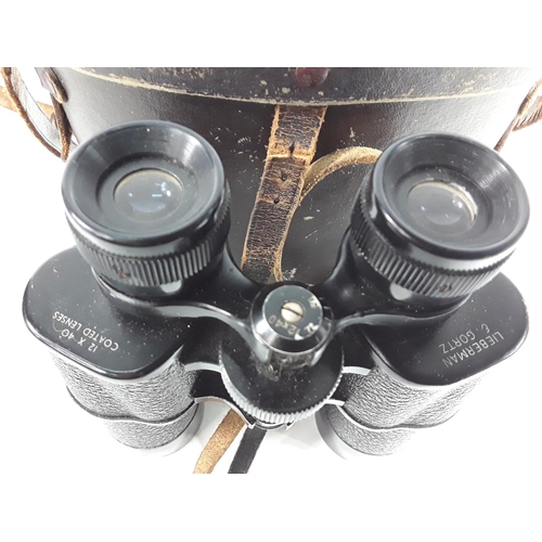 730 - Cased pair of vintage Russian binoculars