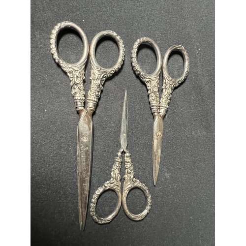 114 - Set of 3 pairs of antique scissors and a leather scissor and letter opener set