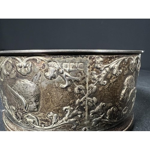 119 - Silver bottle coaster decorated with cherubs - gross 134g - 10.5cm dia