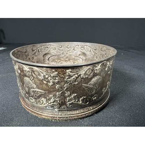 119 - Silver bottle coaster decorated with cherubs - gross 134g - 10.5cm dia