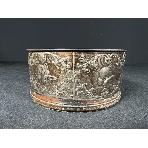 119 - Silver bottle coaster decorated with cherubs - gross 134g - 10.5cm dia