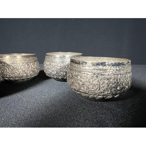 123 - Set of 4 eastern silver pots -Gross 144g, 5.5cm diameter