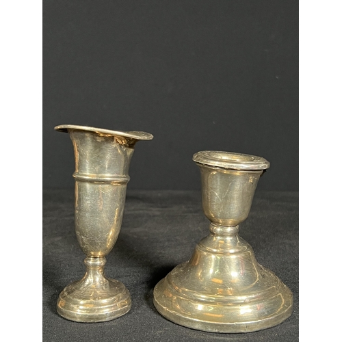 61 - Weighted silver candle stick and weighted silver vase