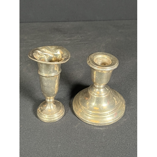 61 - Weighted silver candle stick and weighted silver vase