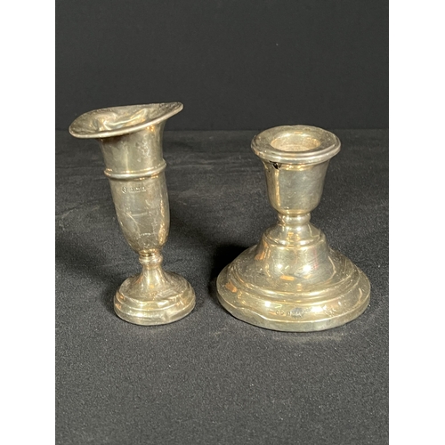 61 - Weighted silver candle stick and weighted silver vase, 10cm tall, 8cm tall