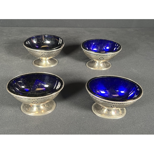 64 - set of 4 silver salts with blue glass liners - Silver weight 278g, 9cm x 6.5cm each