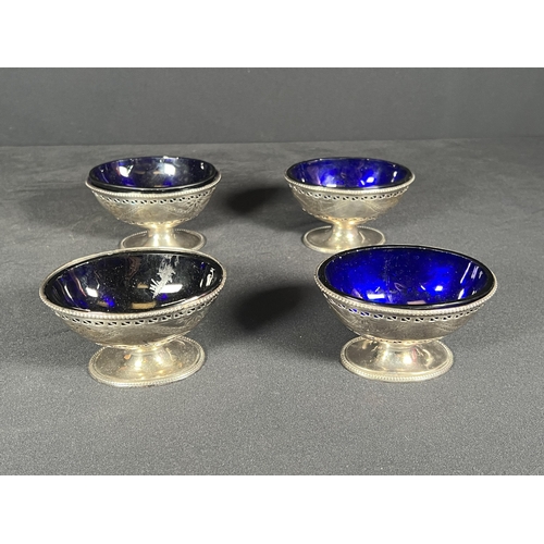 64 - set of 4 silver salts with blue glass liners - Silver weight 278g, 9cm x 6.5cm each