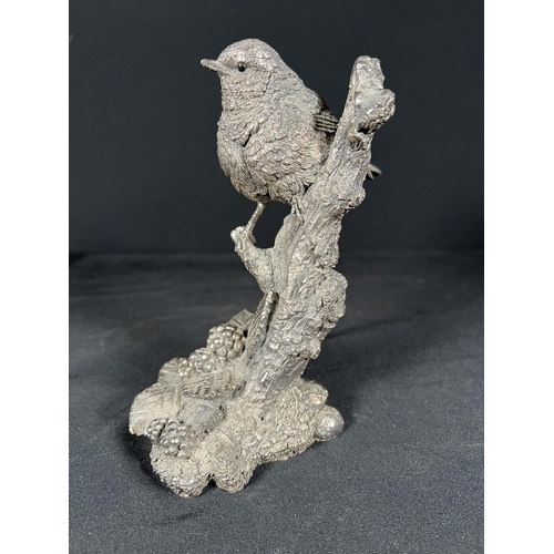 85 - Resin bird on a branch with silver overlay, 16cm tall