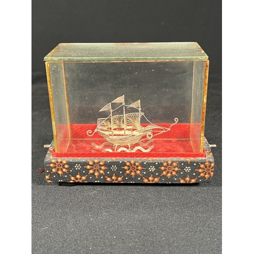 86 - Cased silver filigree boat