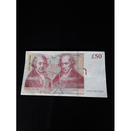 357 - Red £50 note Serial number AK47