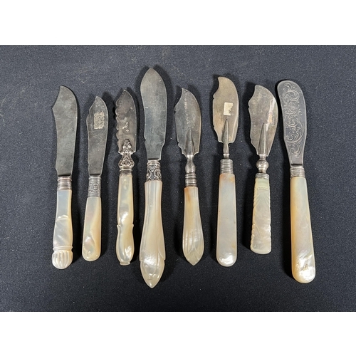 79 - 7 silver bladed butter knives with mother of pearl handles -Gross 290