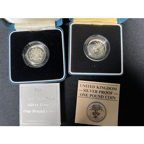 299 - 2 Silver proof £1 coins both with certificates