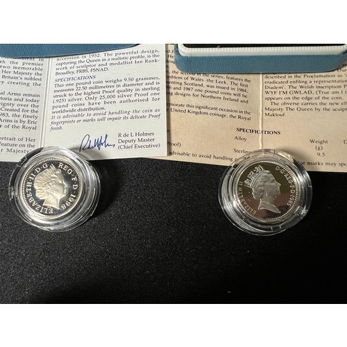 299 - 2 Silver proof £1 coins both with certificates