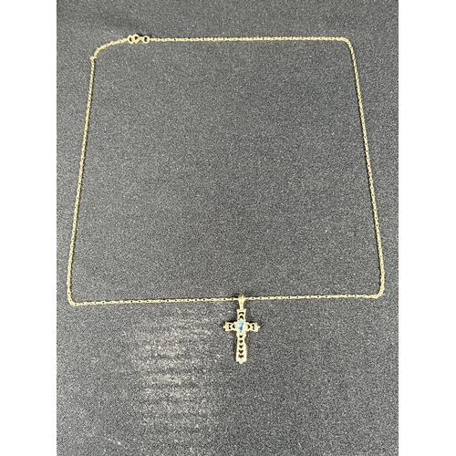 512 - 9ct gold stone set cross on chain, 1.2g gross, 46cm, cross: 2.5cm