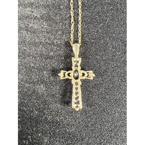 512 - 9ct gold stone set cross on chain, 1.2g gross, 46cm, cross: 2.5cm