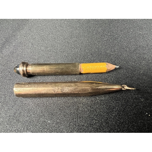 516 - Gold mounted pencil with stone set top, gross 15.7g, 9cm