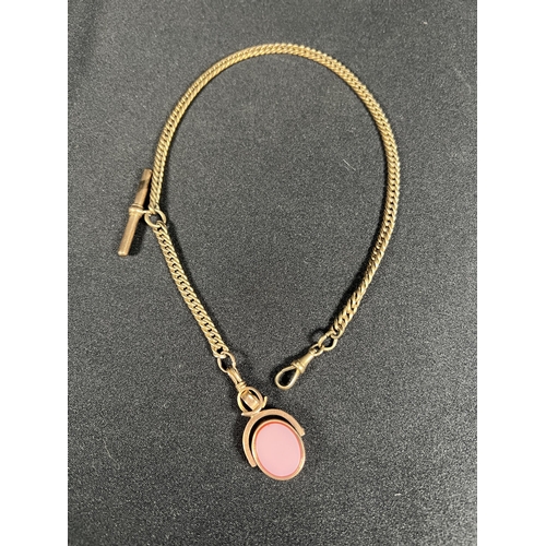 530 - 10ct gold stone set spinning fob on 9ct gold tested albert chain with T bar, 31g gross, chain weight... 