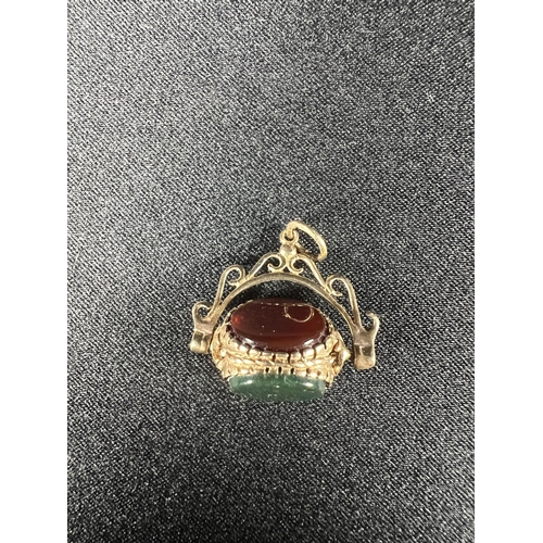 544 - 9ct gold mounted 3 sided spinning seal, 3.2g gross