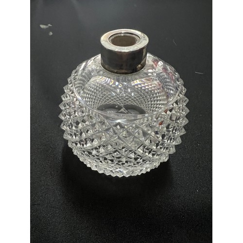 124 - 4 cut glass silver topped vanity bottles