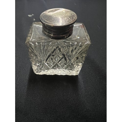 124 - 4 cut glass silver topped vanity bottles