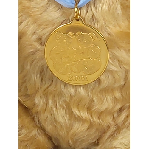 89 - Steiff jointed teddy with medal