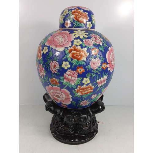 99 - Oriental ginger jar with wooden base, approx 46cms on base, 32cms off base