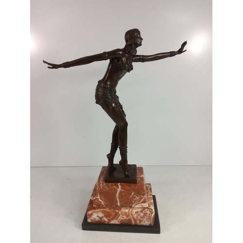 124 - Cast bronze dancing lady on marble base, 50cms in height