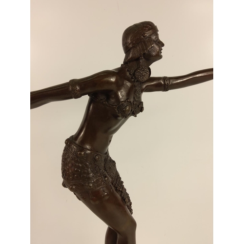 124 - Cast bronze dancing lady on marble base, 50cms in height