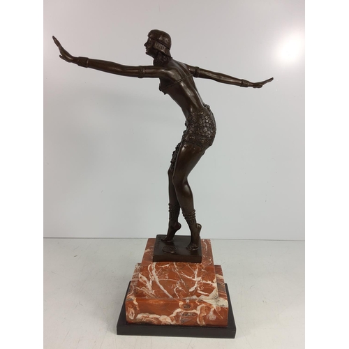 124 - Cast bronze dancing lady on marble base, 50cms in height
