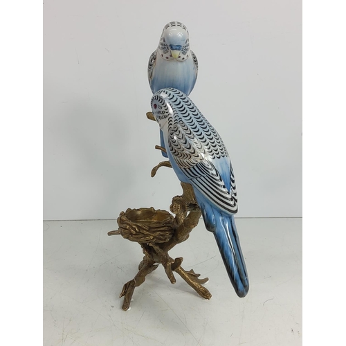 129 - Porcelain and bronze bugie tea light holder