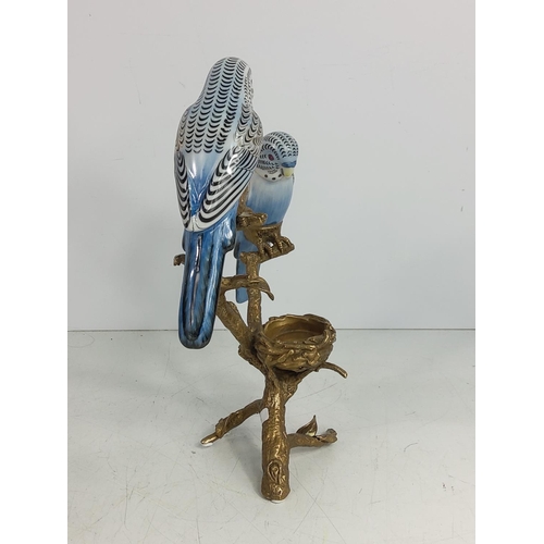 129 - Porcelain and bronze bugie tea light holder