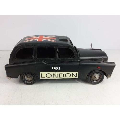 130 - Tin plate model of london buss